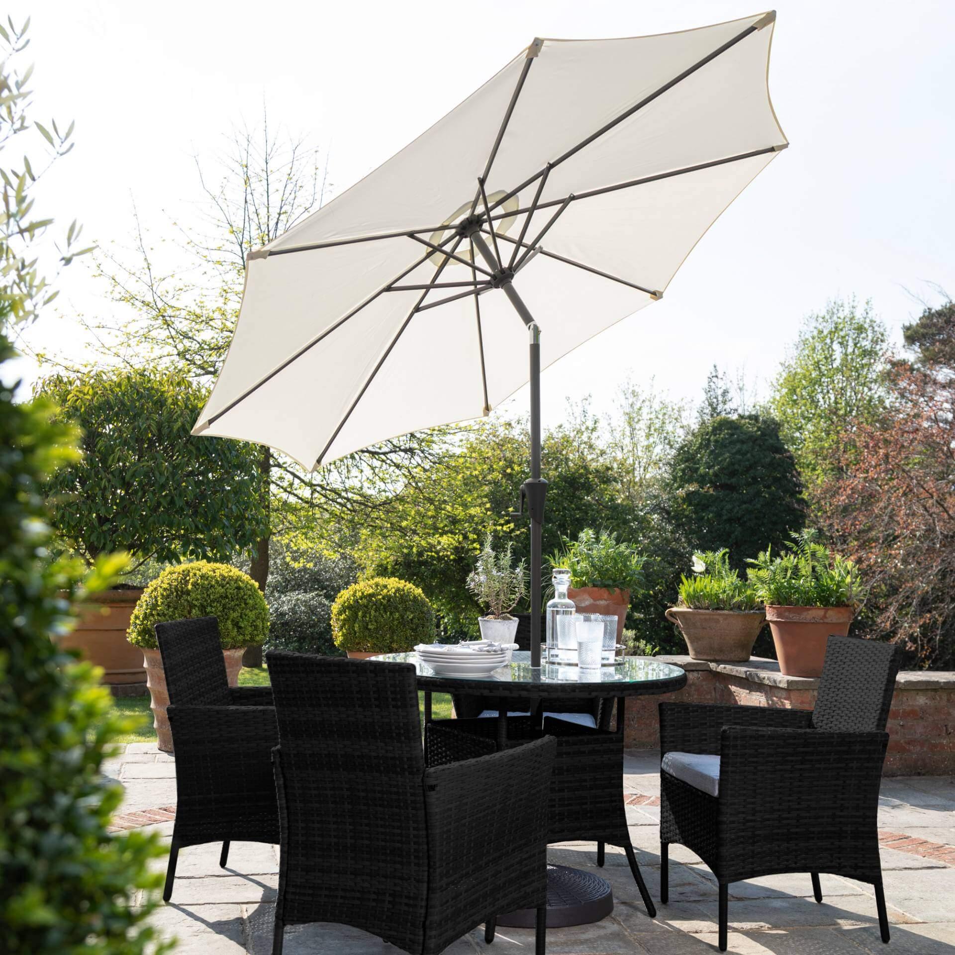 Kemble 4 Seater Rattan Round Dining Set with Cream LED Premium Parasol & Parasol Rain Cover - Black Weave - Image 4